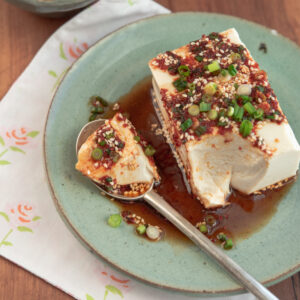 Streamed silken tofu with Korean soy chili sauce is easy to spoon up