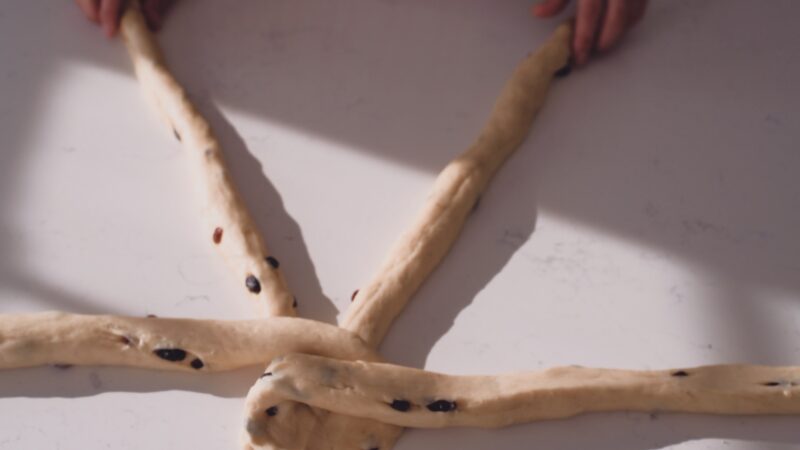 Alternating strands of dough makes a braided look on the bread.