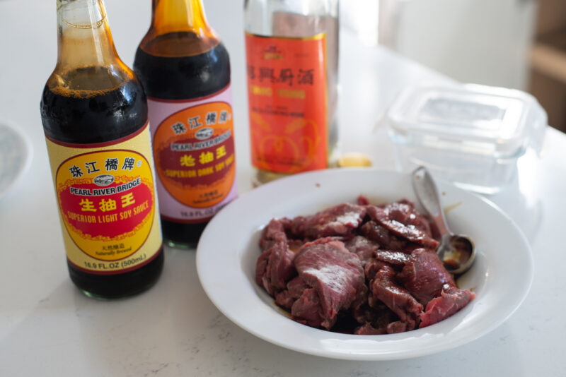 Thinly sliced beef seasoned with soy sauces, shaoxing rice wine, and baking soda.