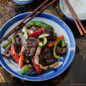Chinese pepper steak stir fry is best to serve hot with rice