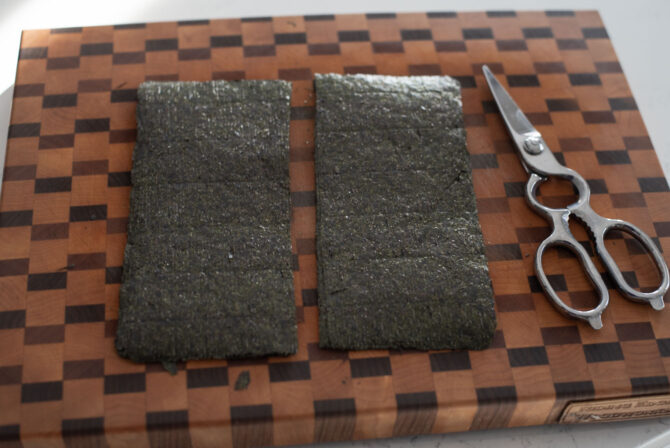 Seaweed sheets are cut in half