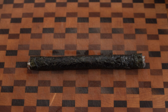 Korean seaweed roll is rolled into a thin log