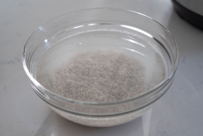 Fermented rice is soaking in a bowl of water.