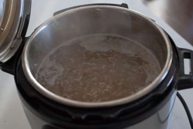 Fermented barley malt water and rice are boiling in the instant pot.