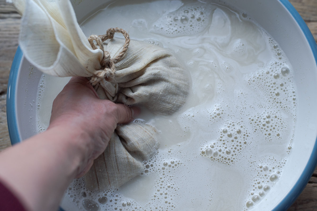 Barley malt inside of kitchen pouch to extract the malt into the water.