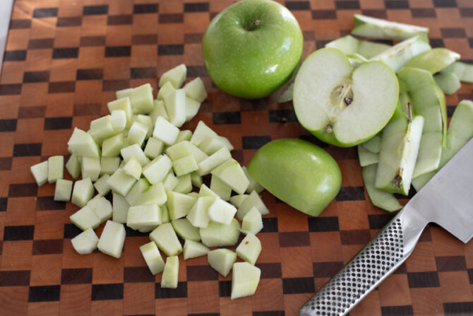 Apple is peeled and chopped into small pieces.