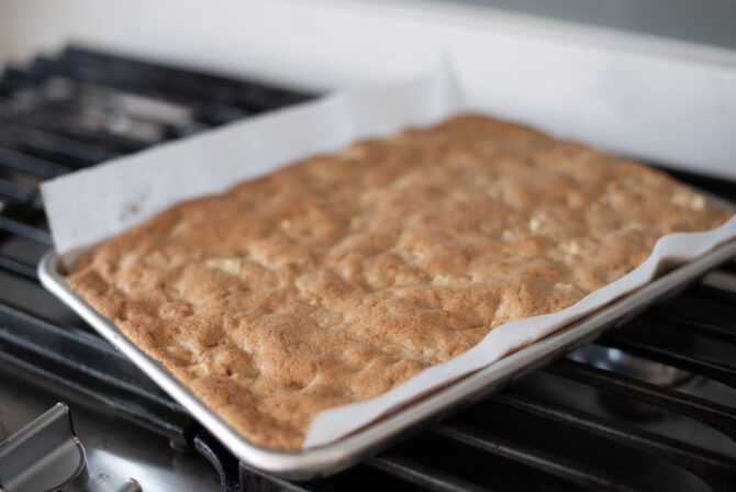 Baked apple bars as an apple dessert in a baking pan.