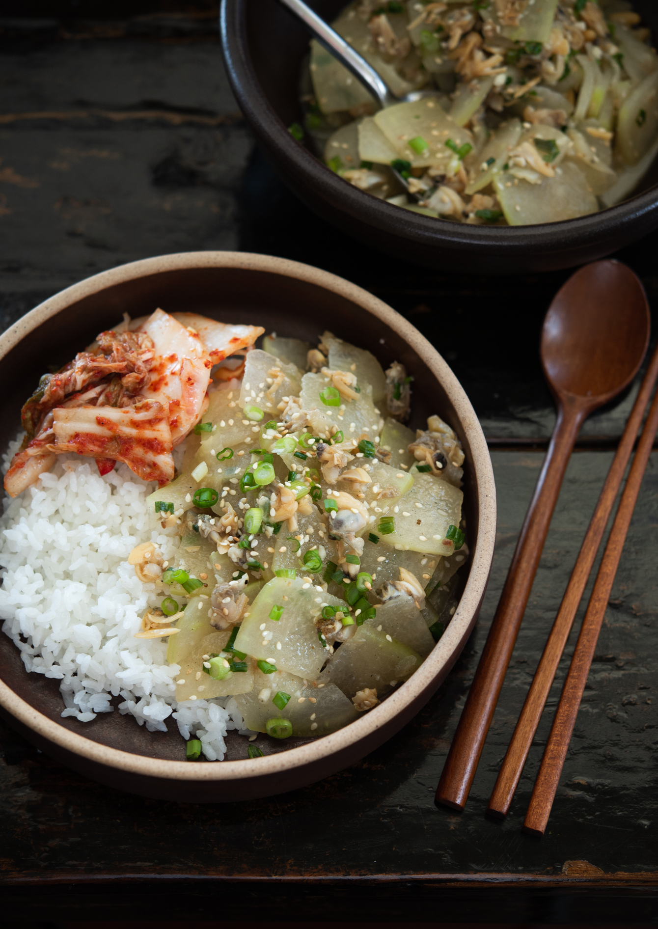 Winter melon with clams served as a rice bowl with kimchi