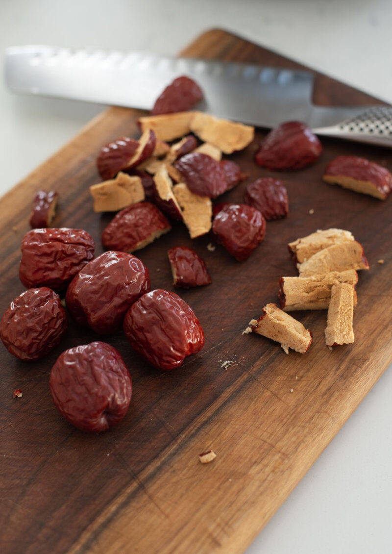 Dried jujube is seeded to garnish sweet rice cake (yakshik).