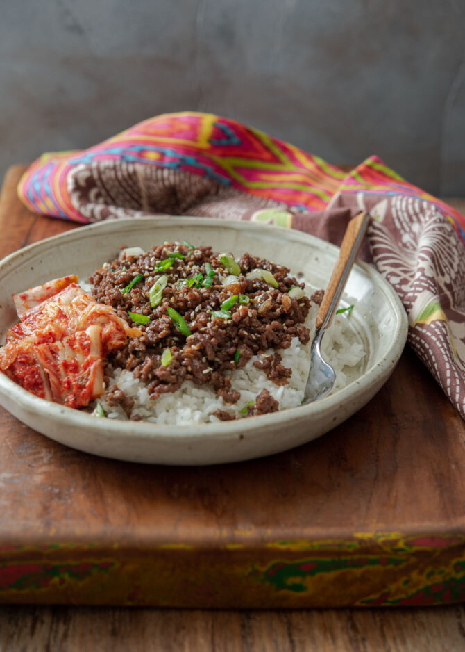 Ground beef bulgogi and kimchi are served in a bowl together as a one dish meal