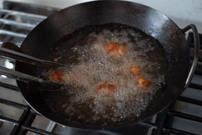 Chicken wings are deep-fried for the second time to ensure the crispiness.