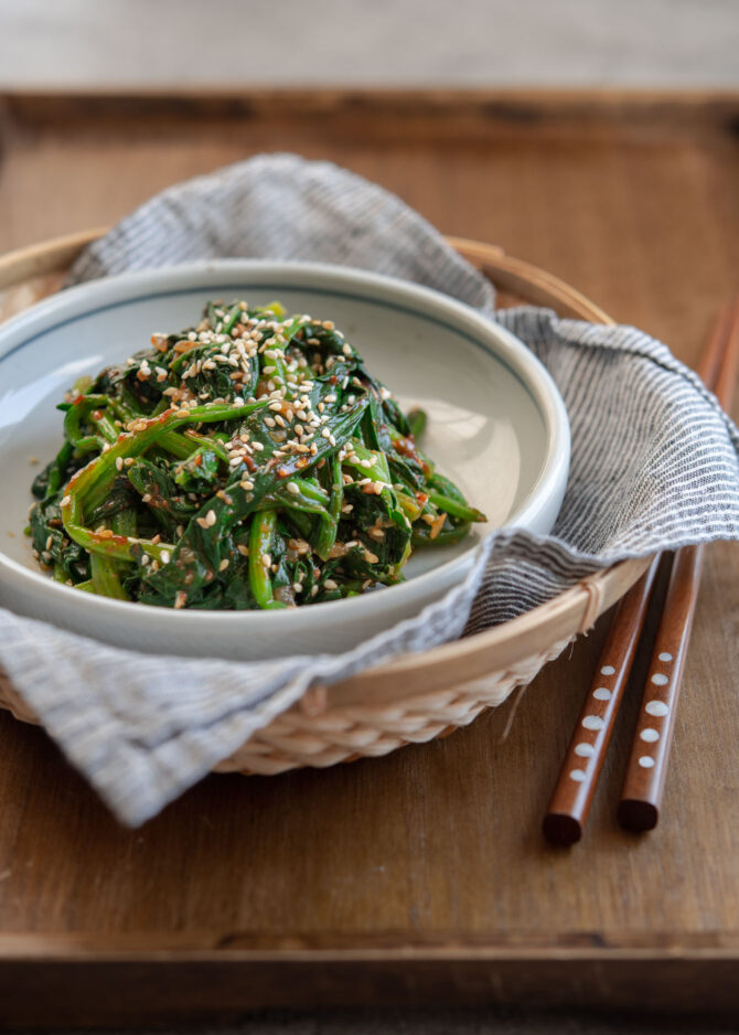 Korean spinach side dish made with gochujang is served in a plate