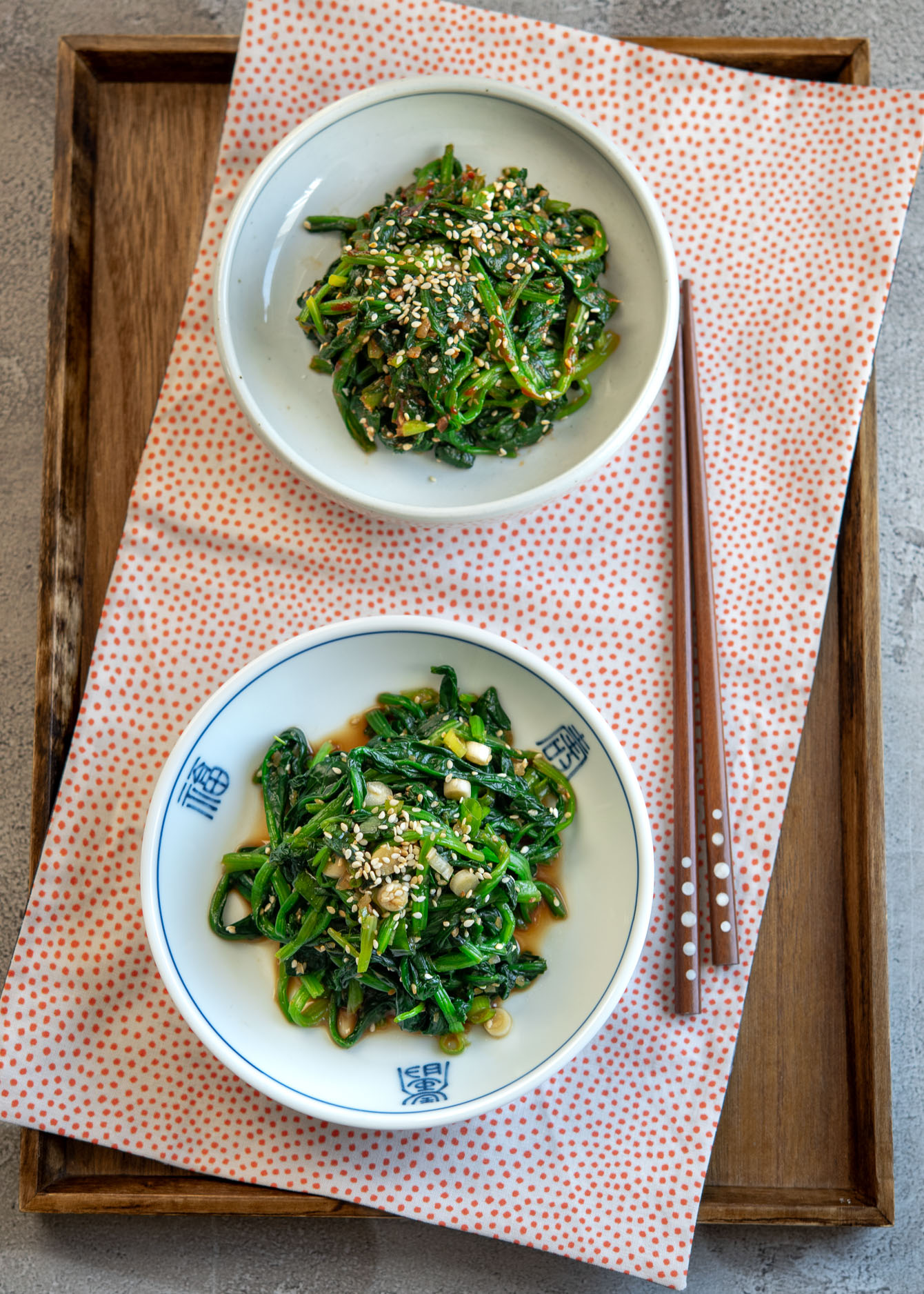 Korean spinach (spinach banchan) made with two different sauces.