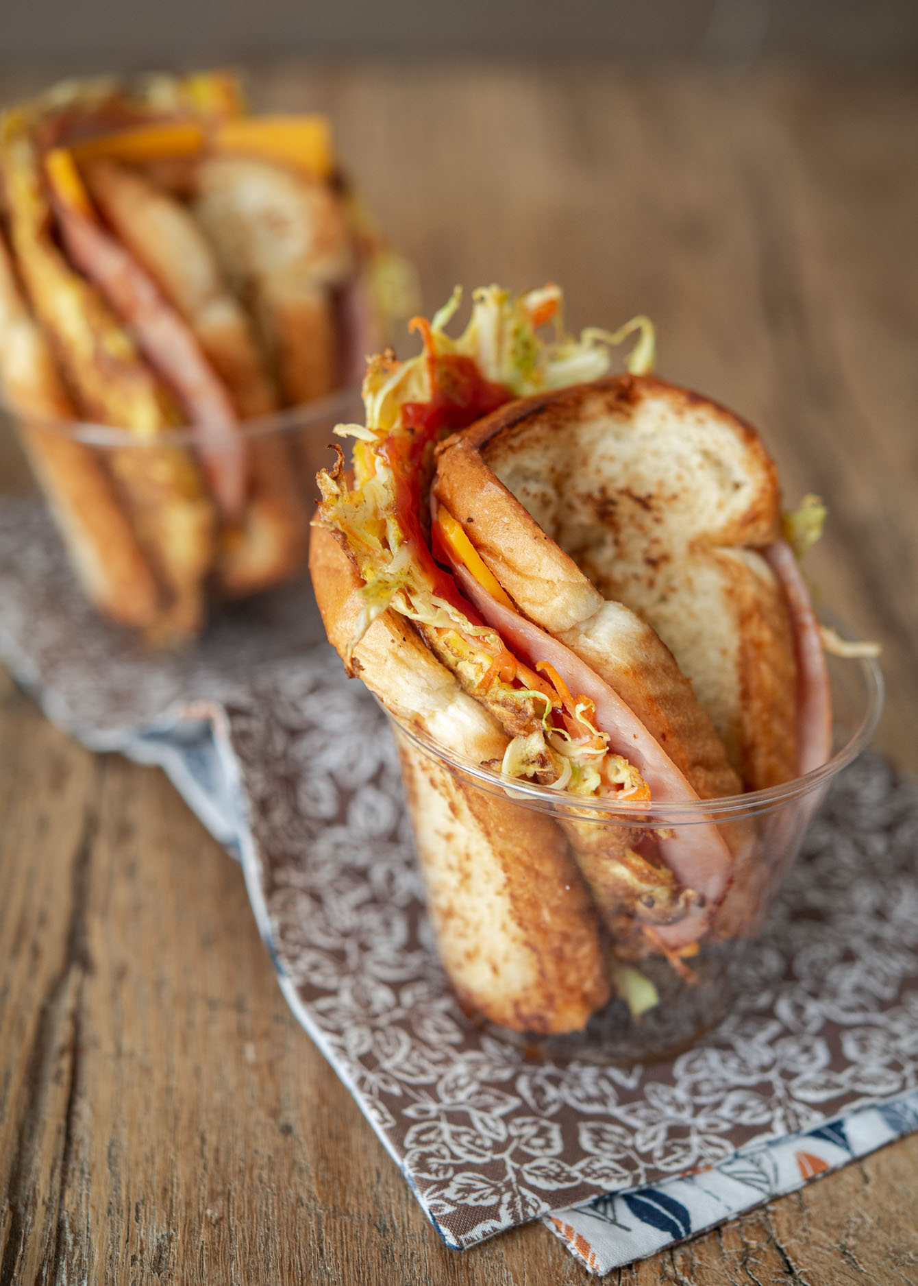 Korean street toast served in a small plastic cup.