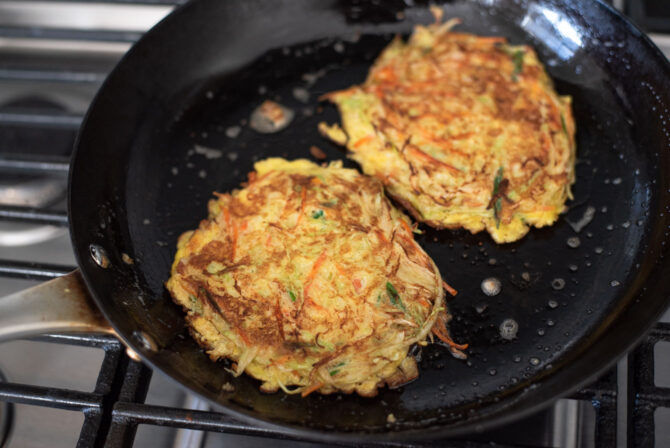 Egg omelettes are cooked to golden brown in a pan