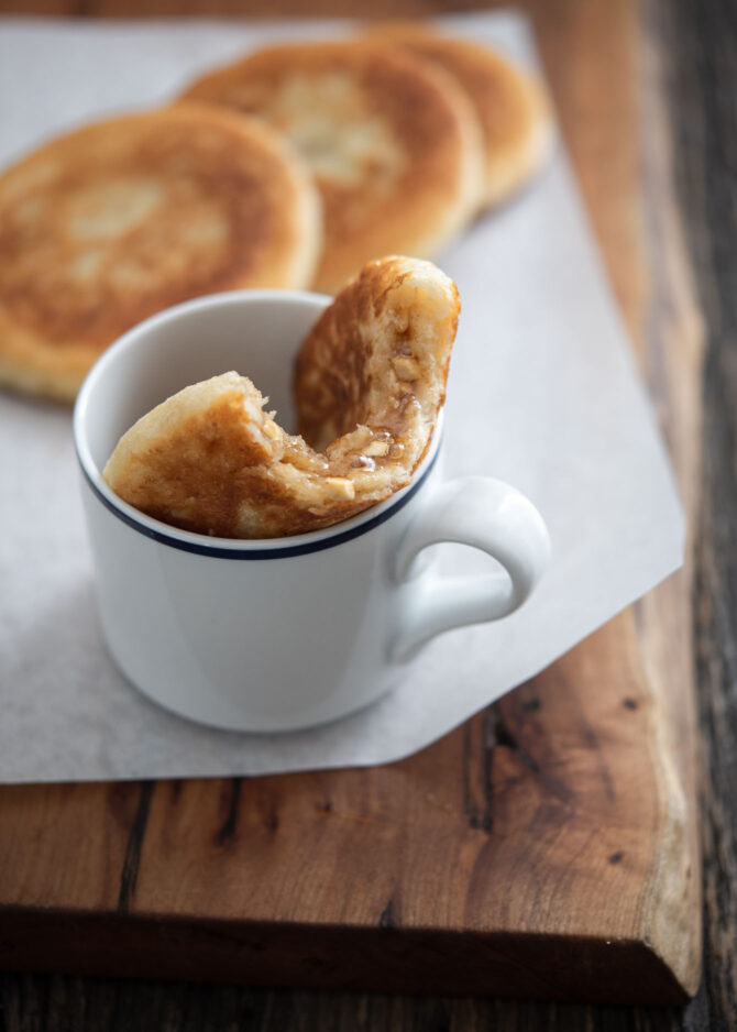 A piece of Kroean sweet pancake is place in a cup.