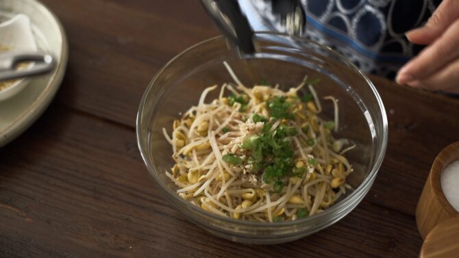 Cooked soybean sprouts are dressed with seasonings