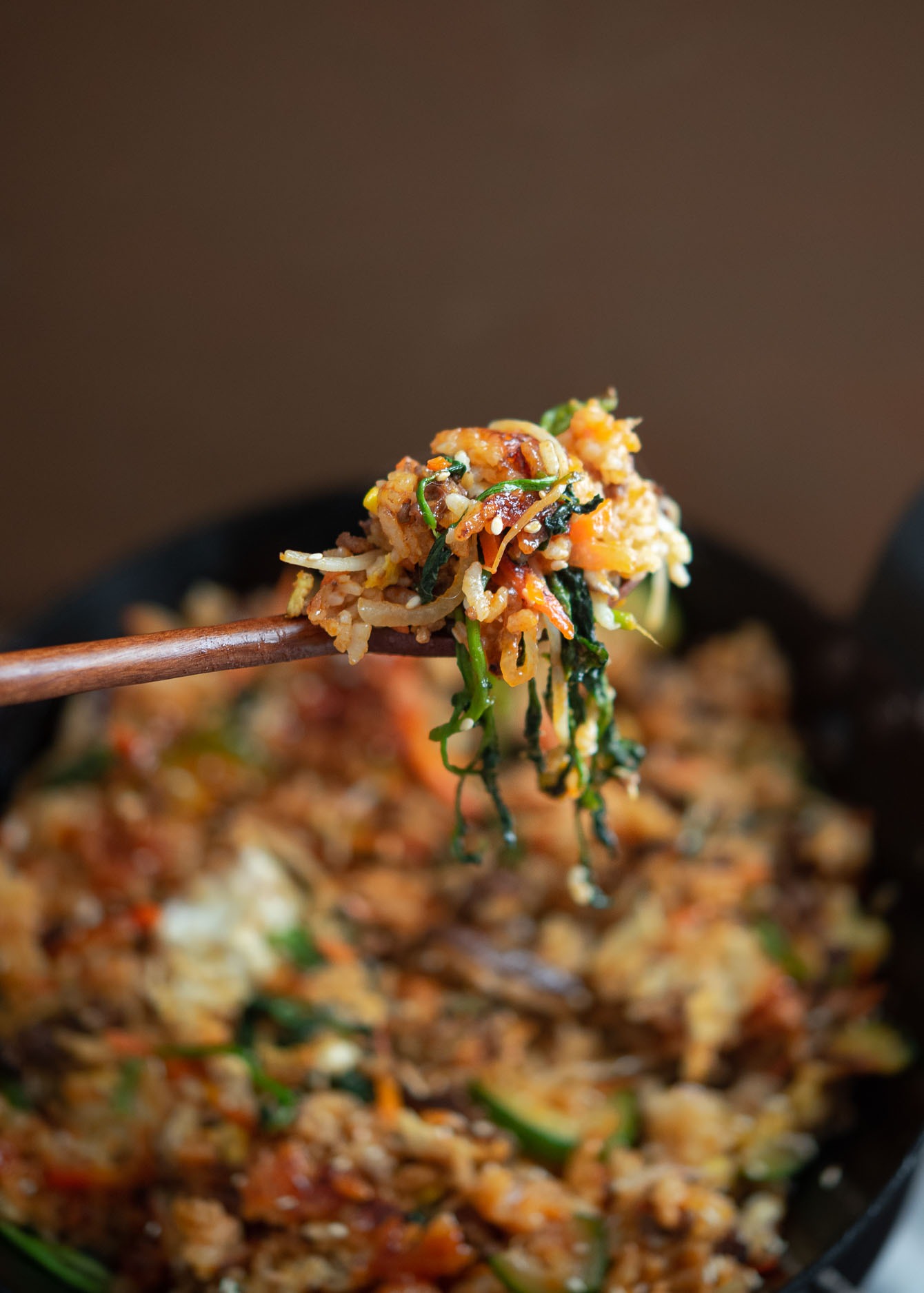A spoonful of bibimbap shows its deliciousness