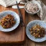 Two types of Korean anchovy side dishes are served with rice