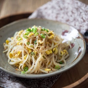 Soybean sprouts are served as a side dish on the napkin.