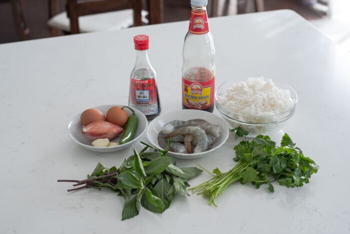 The ingredients for making Thai basil fried rice are presented.