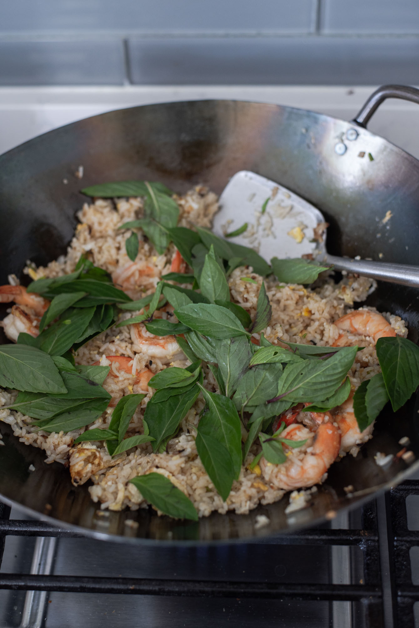 Thai basil leaves are added to the s fried rice at the end