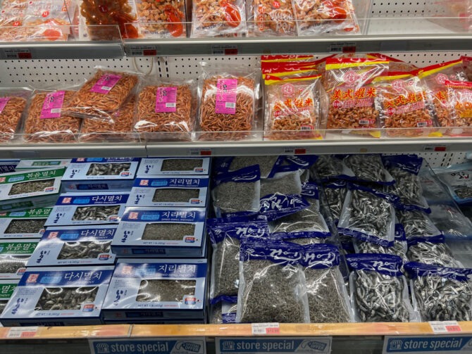 Korean dried anchovies and shrimps are on the shelf of Korean store.