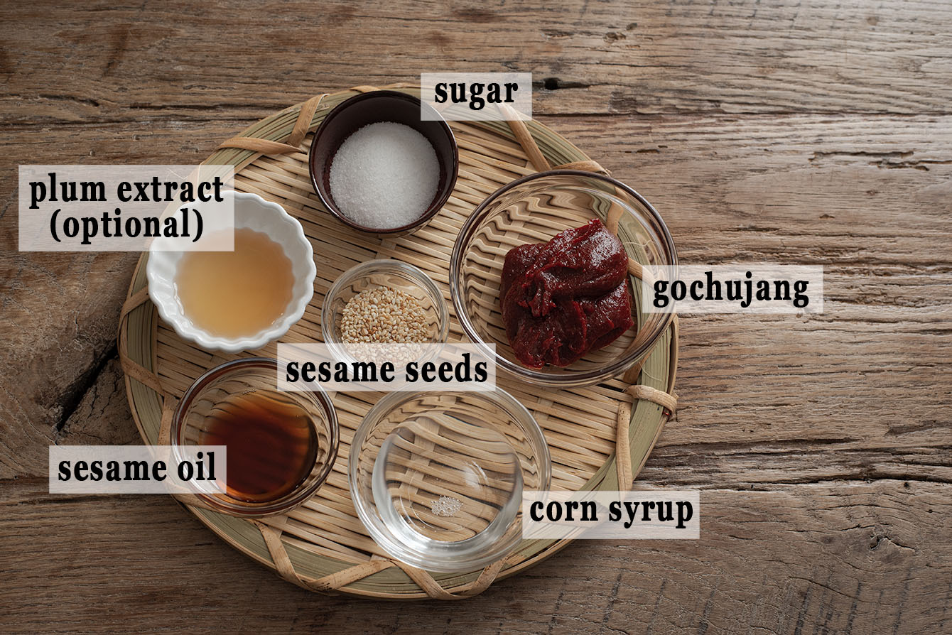 Ingredients for bibimbap sauce are placed on a basket tray