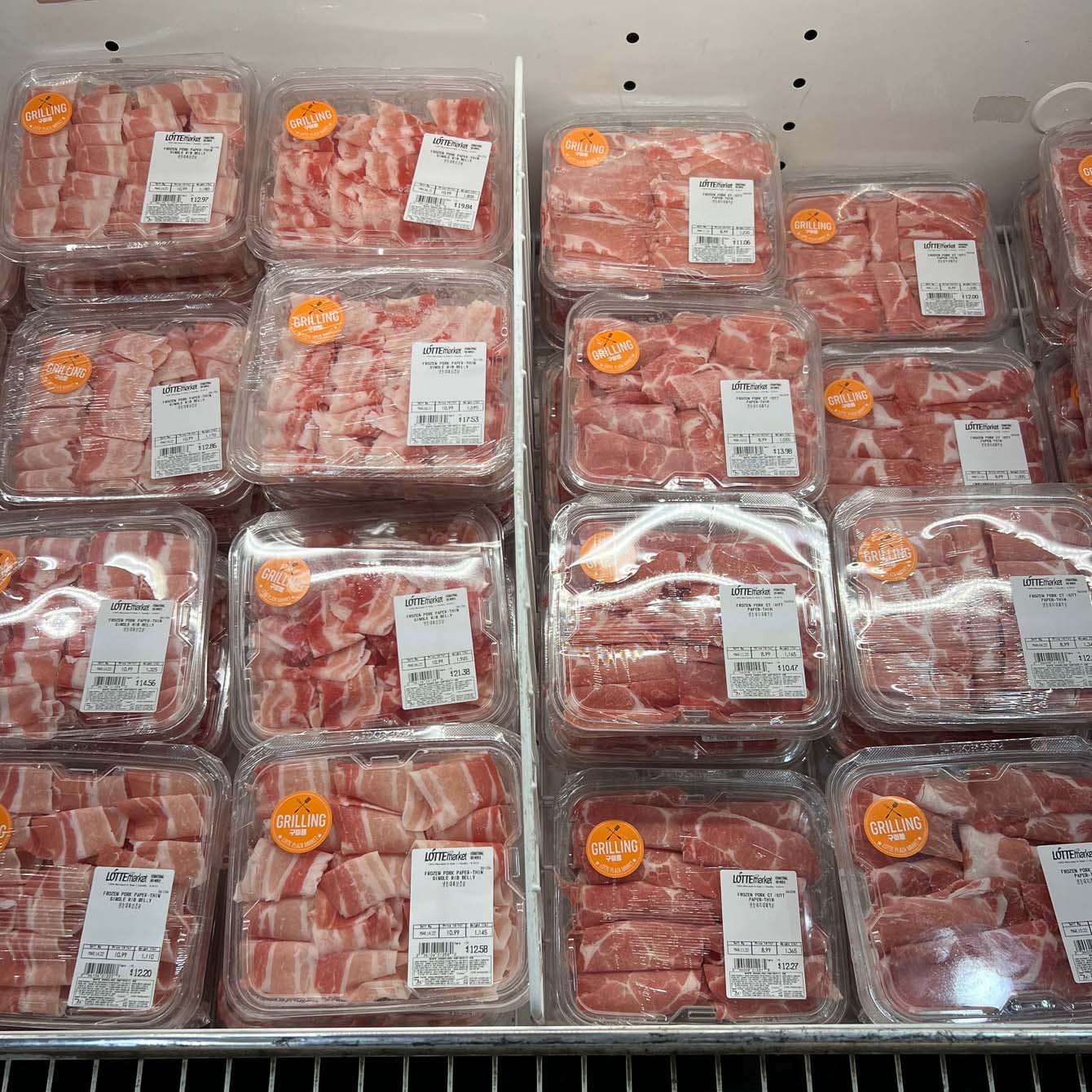 Thin Korean pork belly slices are packed and sold as frozen 