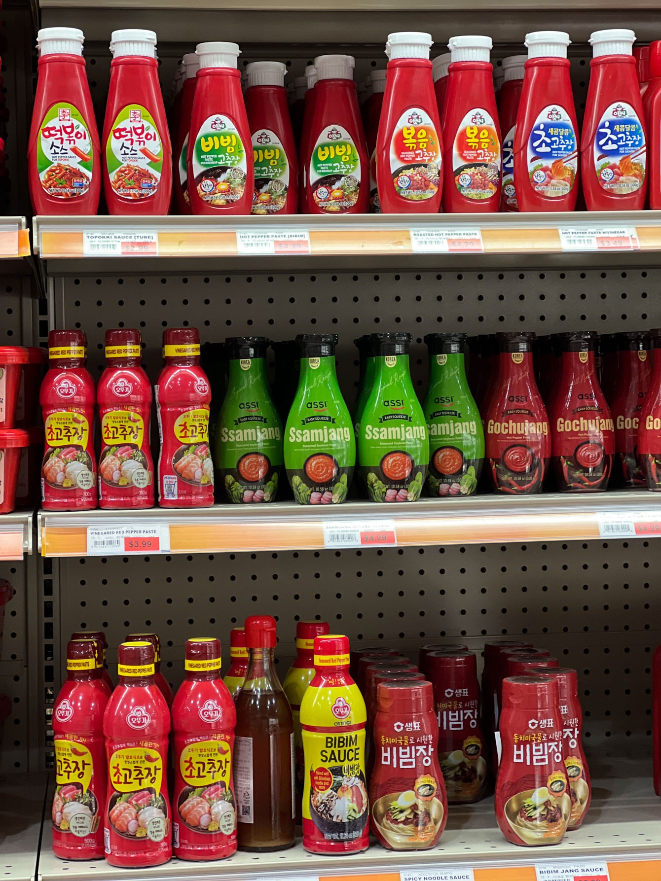 Commercially made seasoned gochujang bottles in a Korean Korean grocery store.
