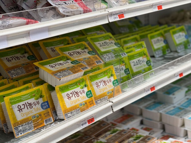 Various types of Korean tofu are displayed on the shelf