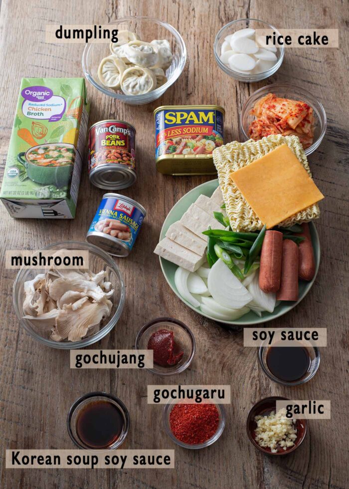 Ingredients for making budae jjigae is arranged on the counter to display.