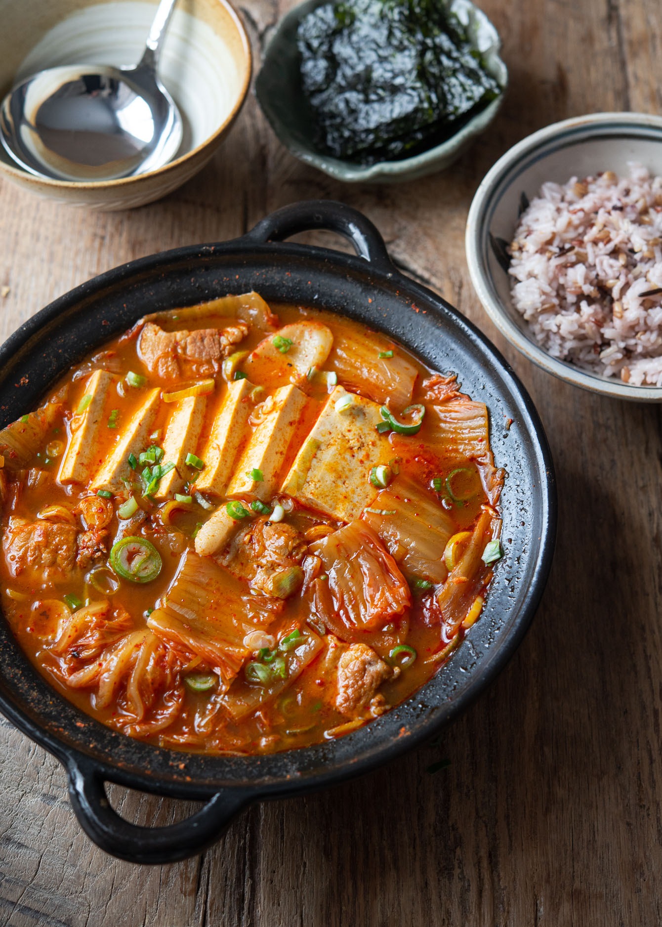 Kimchi stew made with pork and tofu, a classic kimchi jjigae.