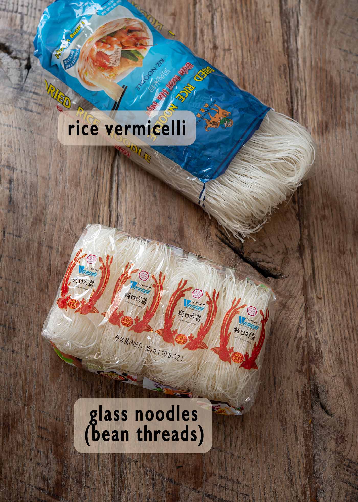 A packet of rice vermicelli and Thai glass noddles are shown together to compare.