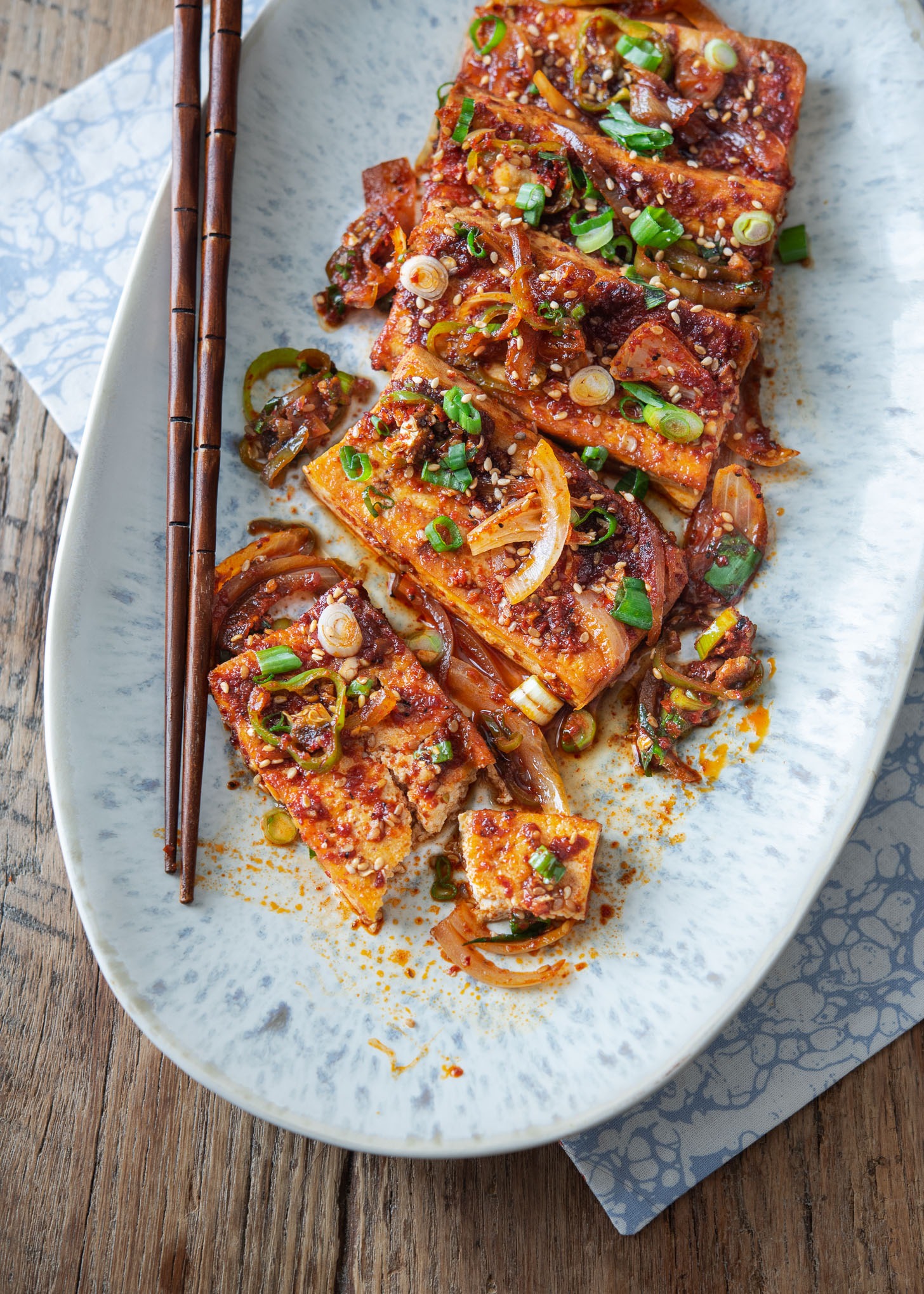 Spicy Korean braised tofu (dubu jorim) placed in an oval platter.