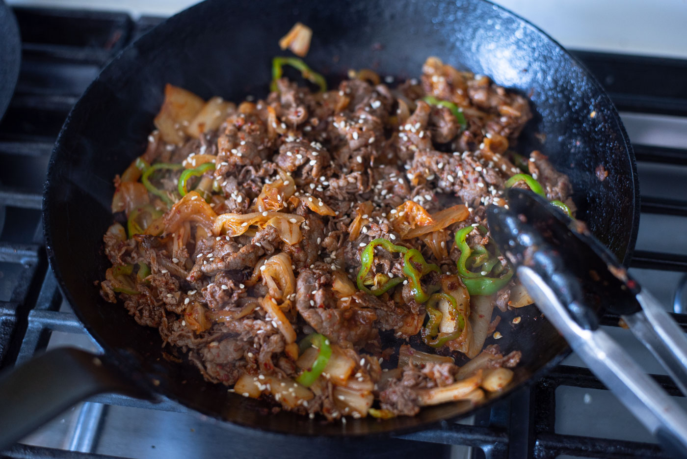 Bulgogi cheesesteak filling is ready in a skillet.