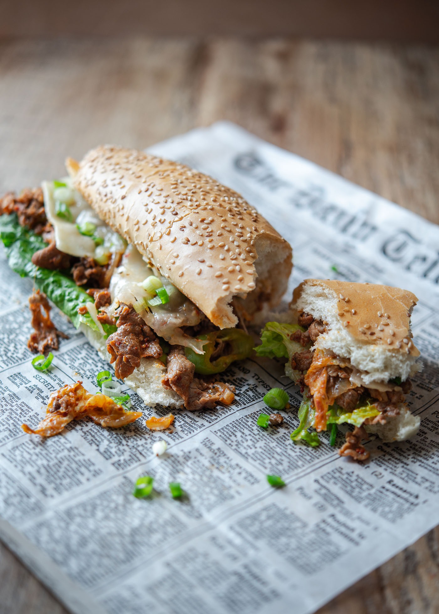 Bulgogi cheesesteak contains Korean beef bulgogi and kimchi in a hoagie roll.