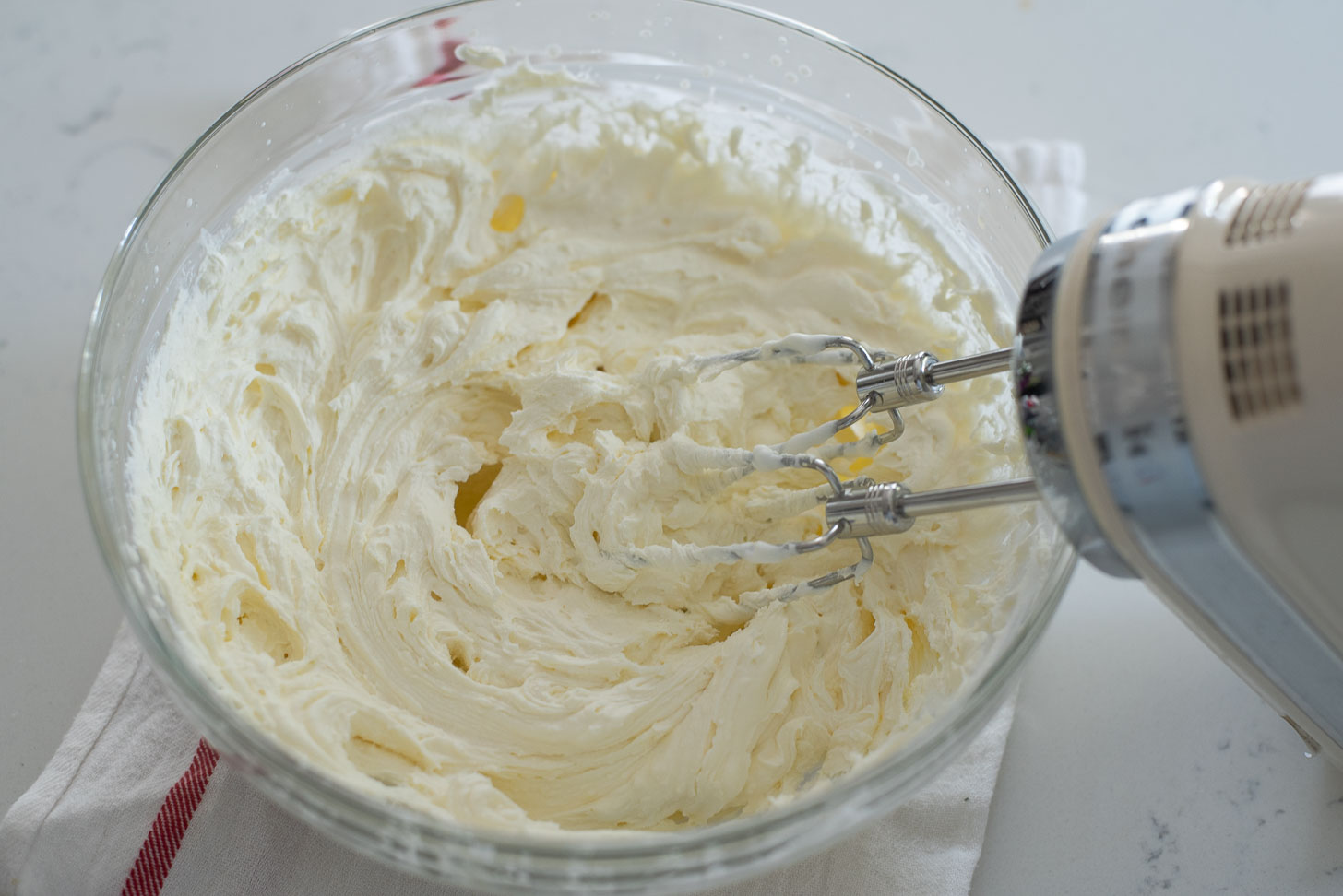 Mix whipped cream and mascarpone cheese together for making Tiramisu custard 