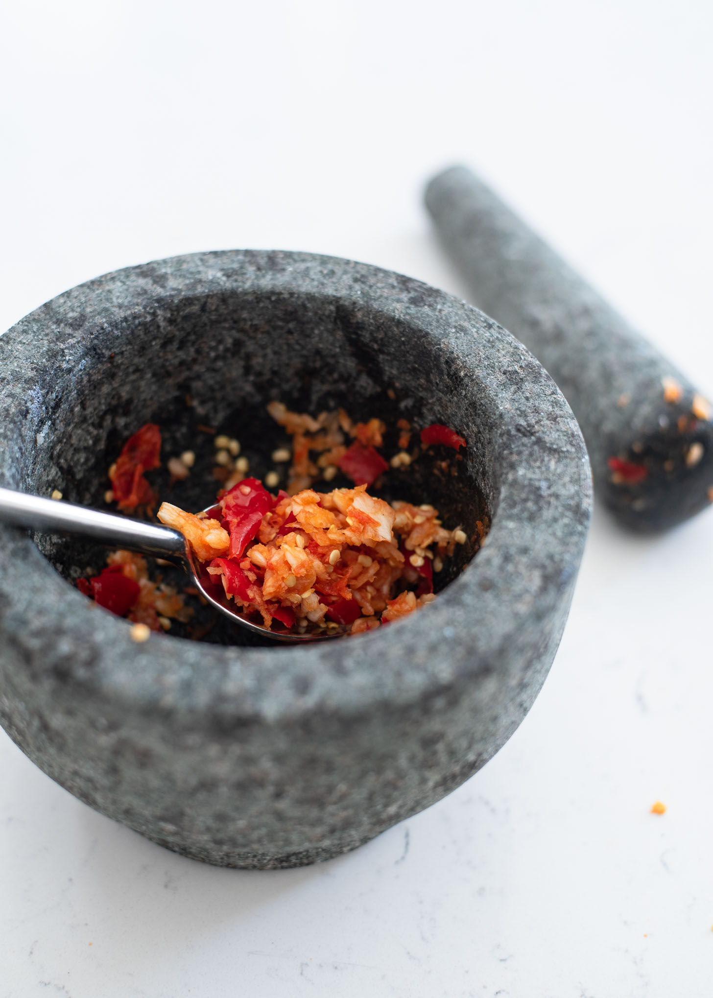 Smashed garlic and chili in a mortar