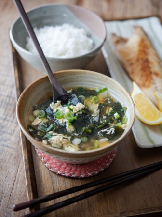 Seaweed egg drop soup is served with rice and fish.