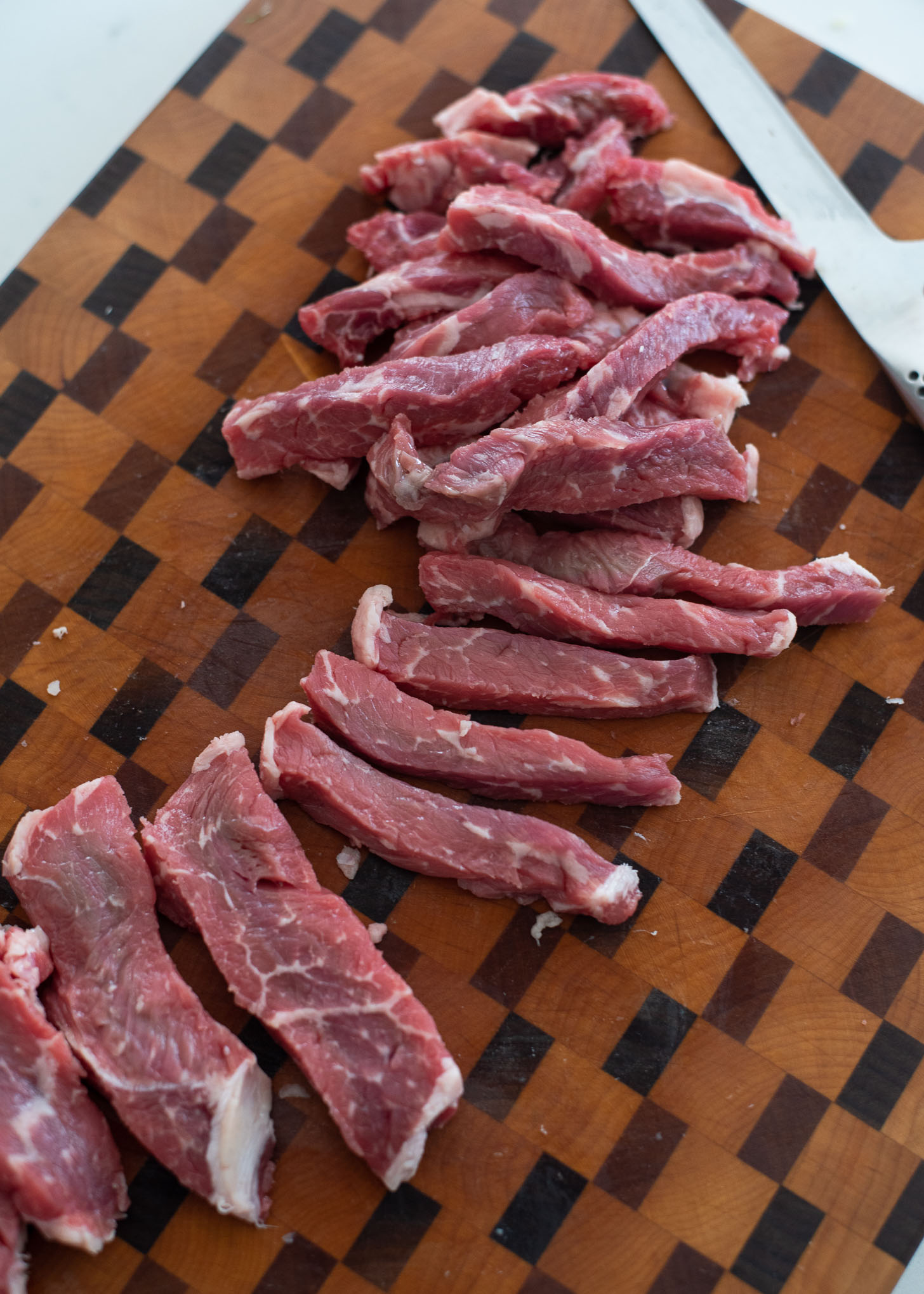Beef steak is cut into strips to make crispy beef
