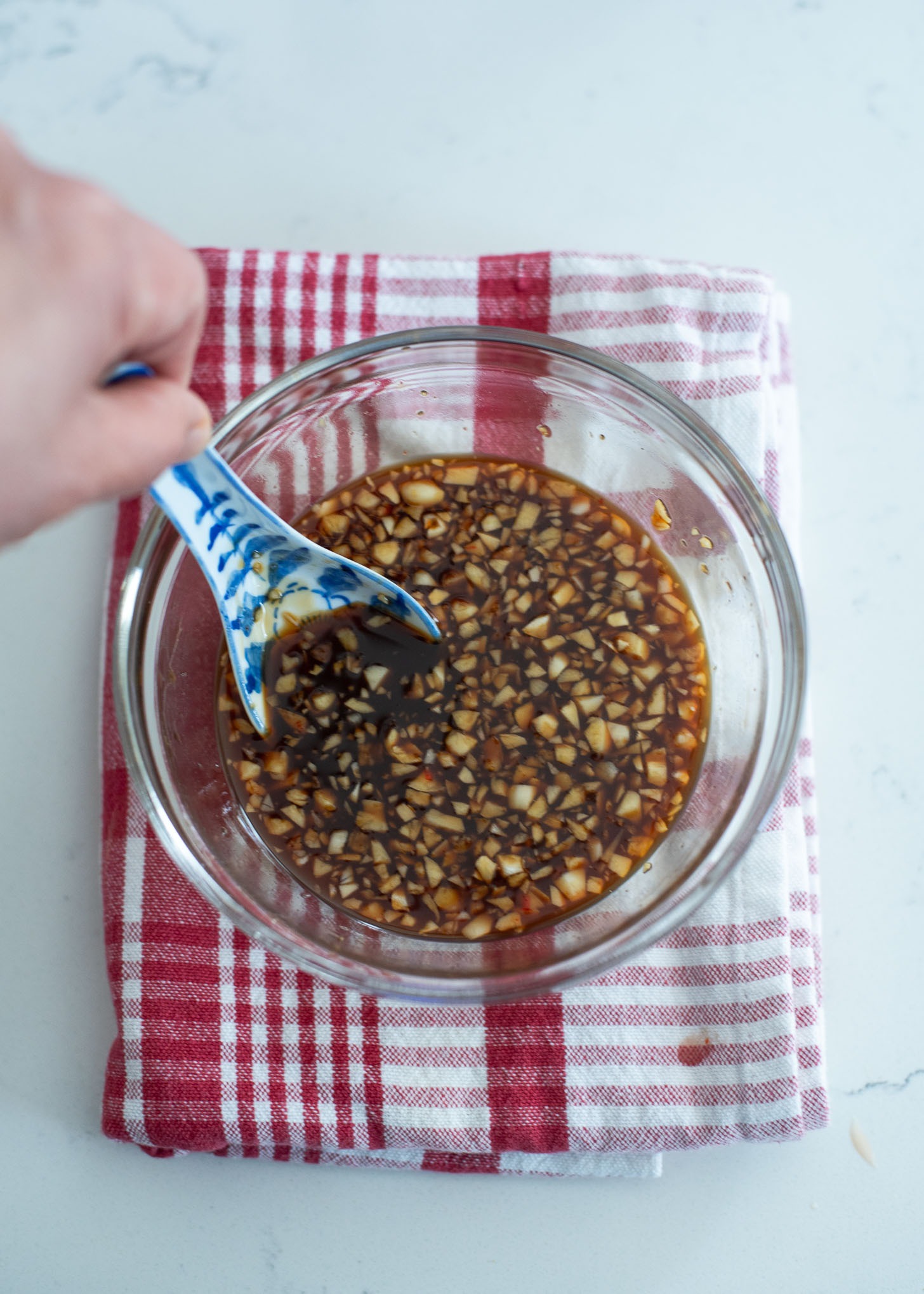 Sweet and tangy crispy beef sauce is combined in a bowl.