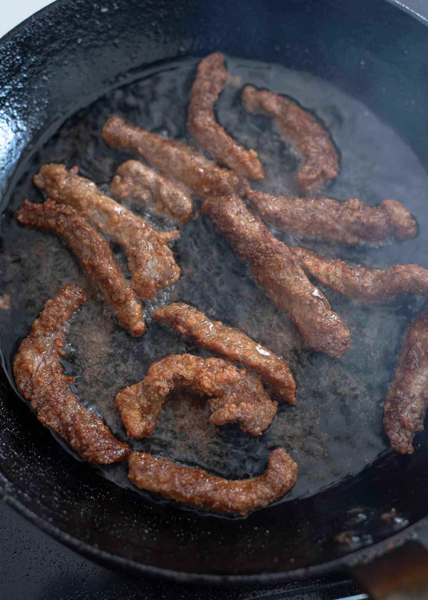 Beef strips are deep fried again for the second time to make crispy beef.