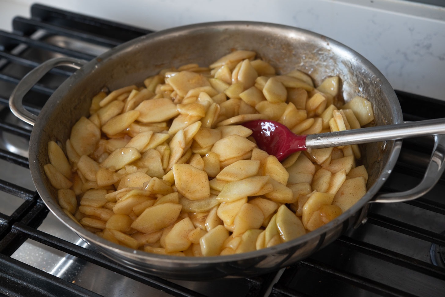 The apple filling is cooked until soft and thickened.