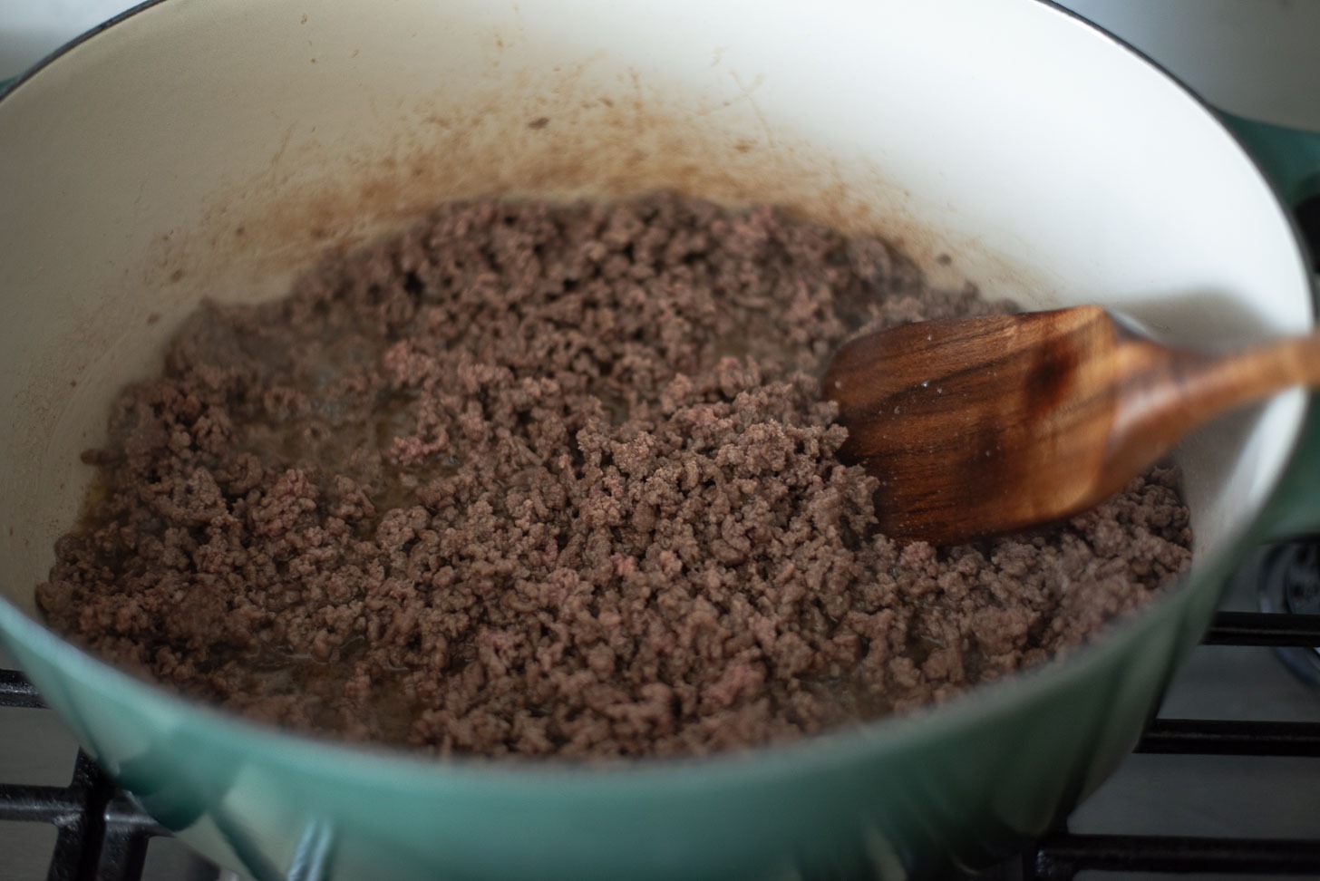 Ground beef is browned in a large pot.