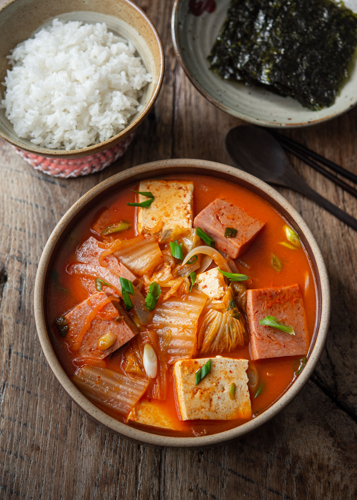 Easy Spam kimchi jjigae served with rice and roasted seaweed.