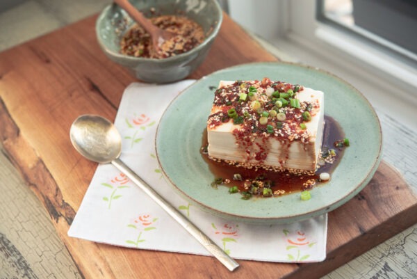 Steamed soft tofu is topped with soy chili sauce.