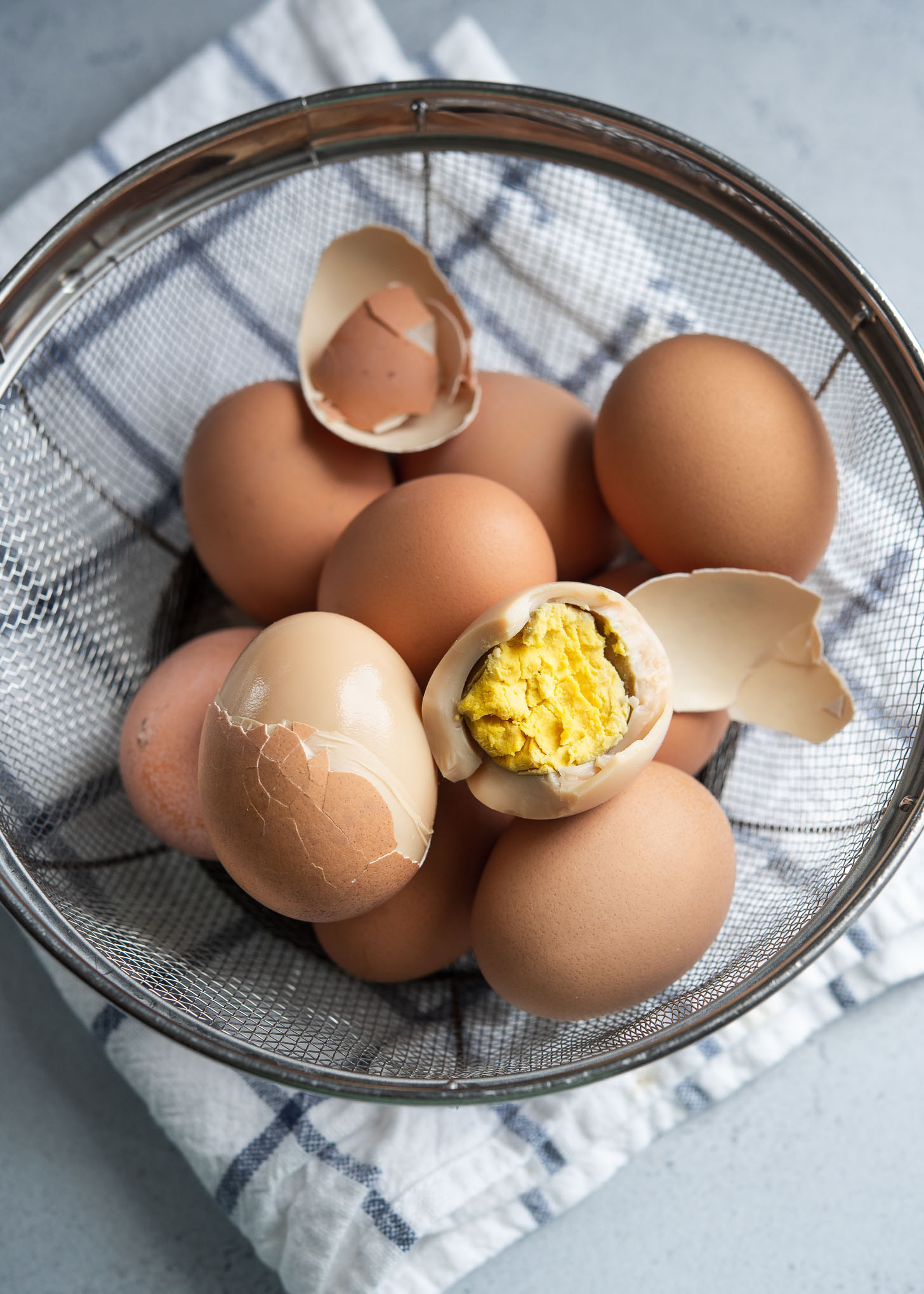 Korean sauna eggs are showing the nutty brown color on the egg whites and rich egg yolks.