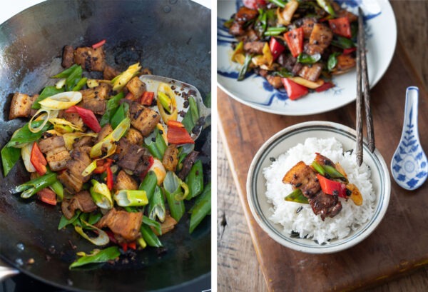 Asian leek and red chili are added to twice cooked pork in a wok.