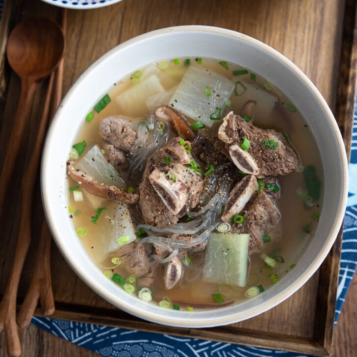 Galbitang soup made with beef short ribs are served with rice and kimchi.